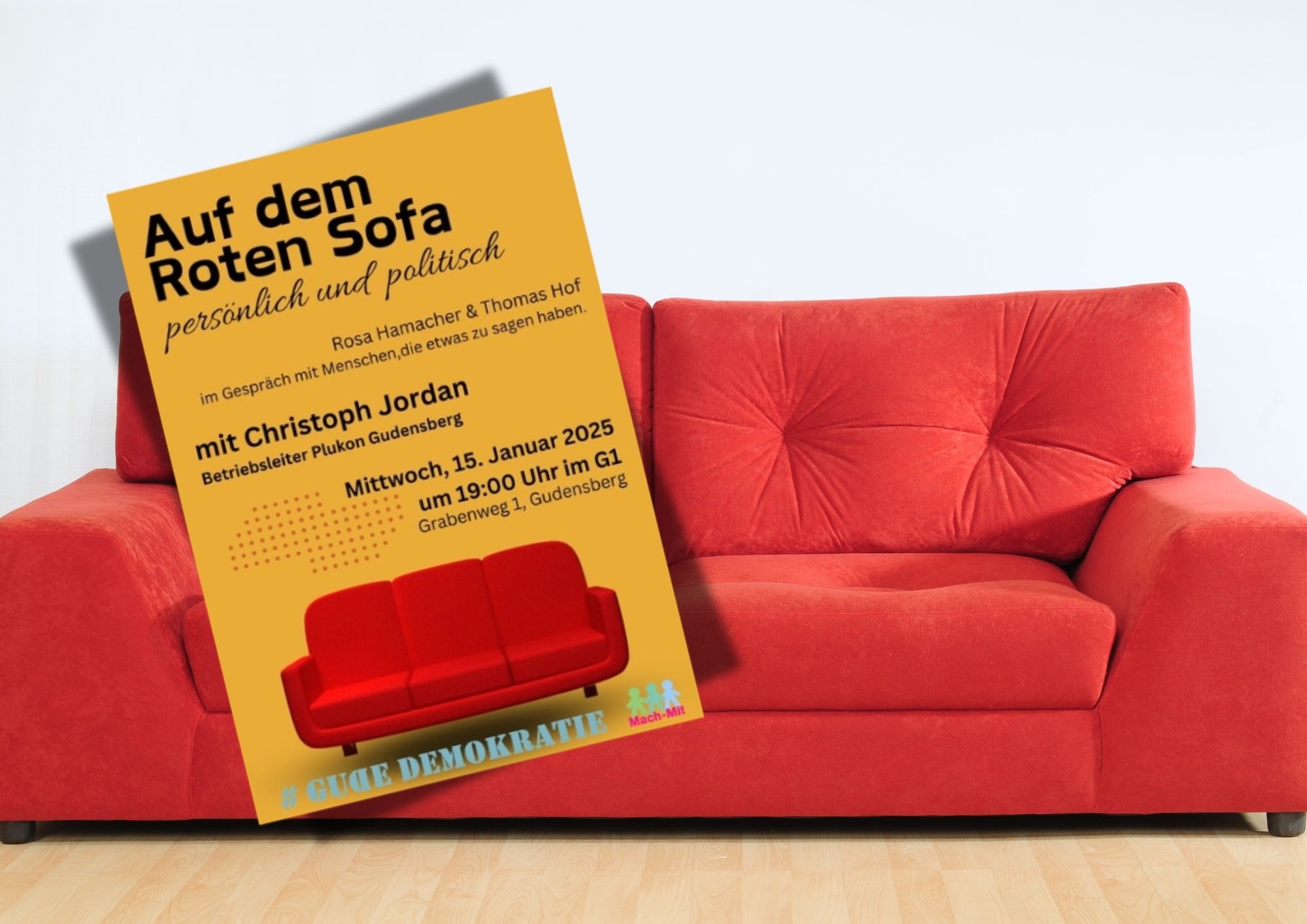 rotes Sofa und ein Plakat